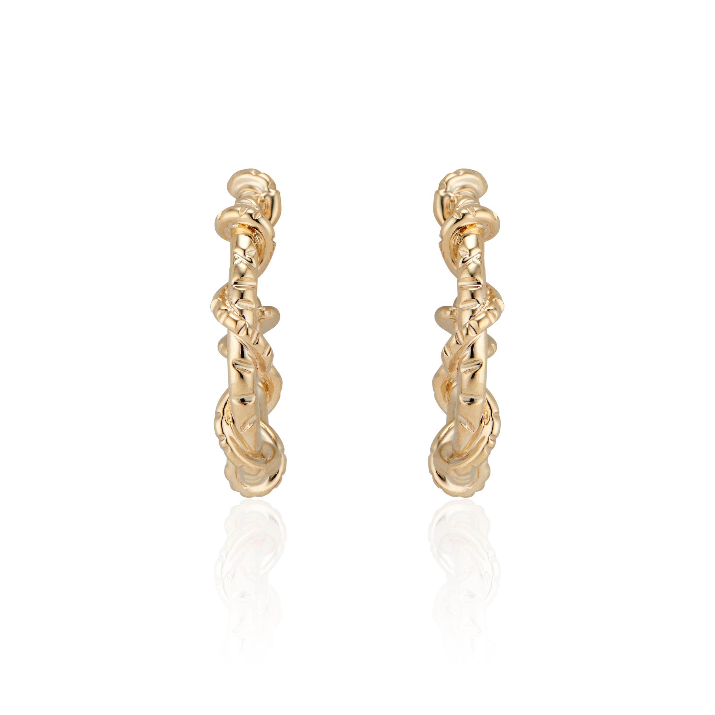 Edgy and fun, these mid sized Spike Hoops feature Natalie McMillan's signature etchings with a literal twist. They are made of solid 14k Gold, so you can wear them every day for a lifetime! 