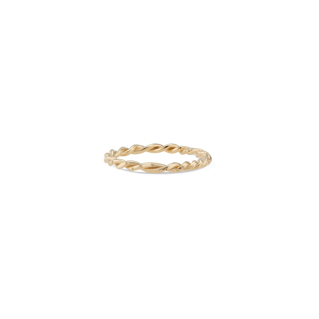 This 14k gold twisted Lauren Ring features Natalie McMillan's signature etchings. It is the ultimate stacking ring, as its thin, twisted design effortlessly goes with any ring it gets paired with! 